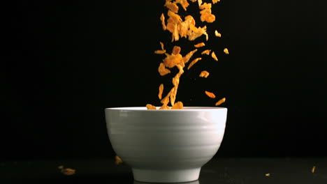 cereal falling in a white bowl