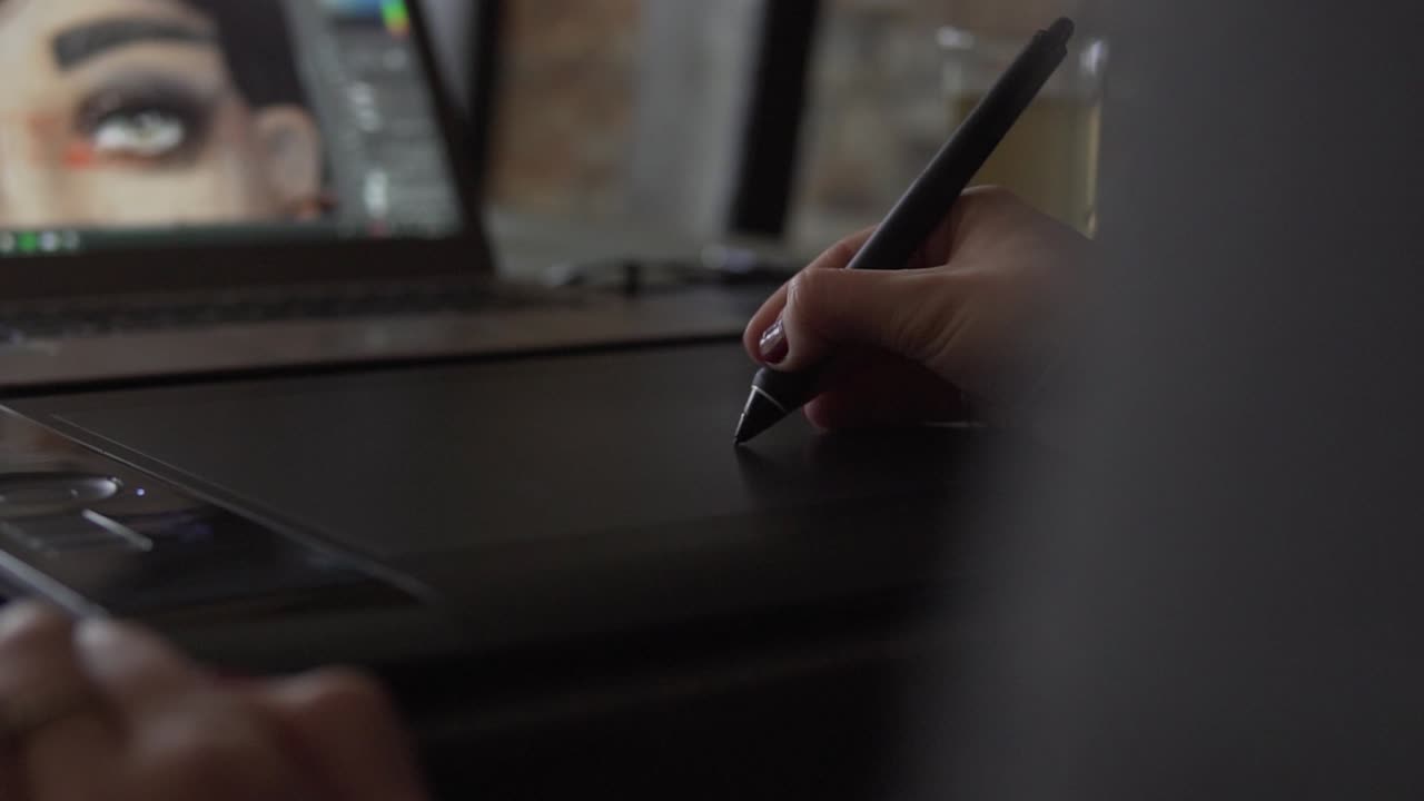 SLOW MOTION: Female Graphic Designer working with tablet and digital pen