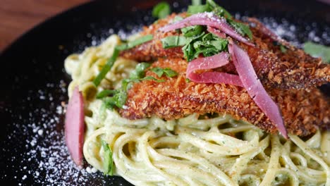 delicious breaded chicken with creamy pesto pasta