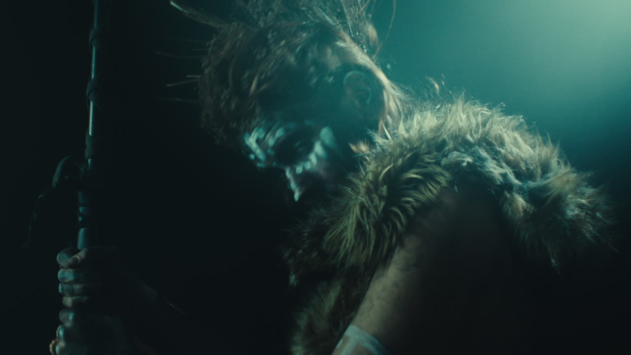 A creepy witch rises her head during the night storm