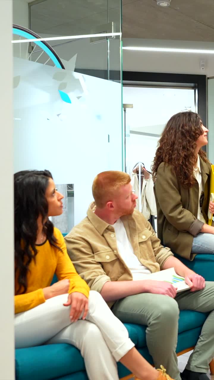 Business Meeting with Coworkers in an Office