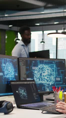 vertical video female programmer in office integrating ai machine learning systems