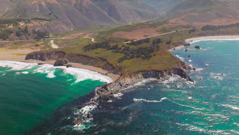 amazing panorama of azure ocean waters meeting bare rocks. sunny view of morro bay, california, usa on beautiful clear day.
