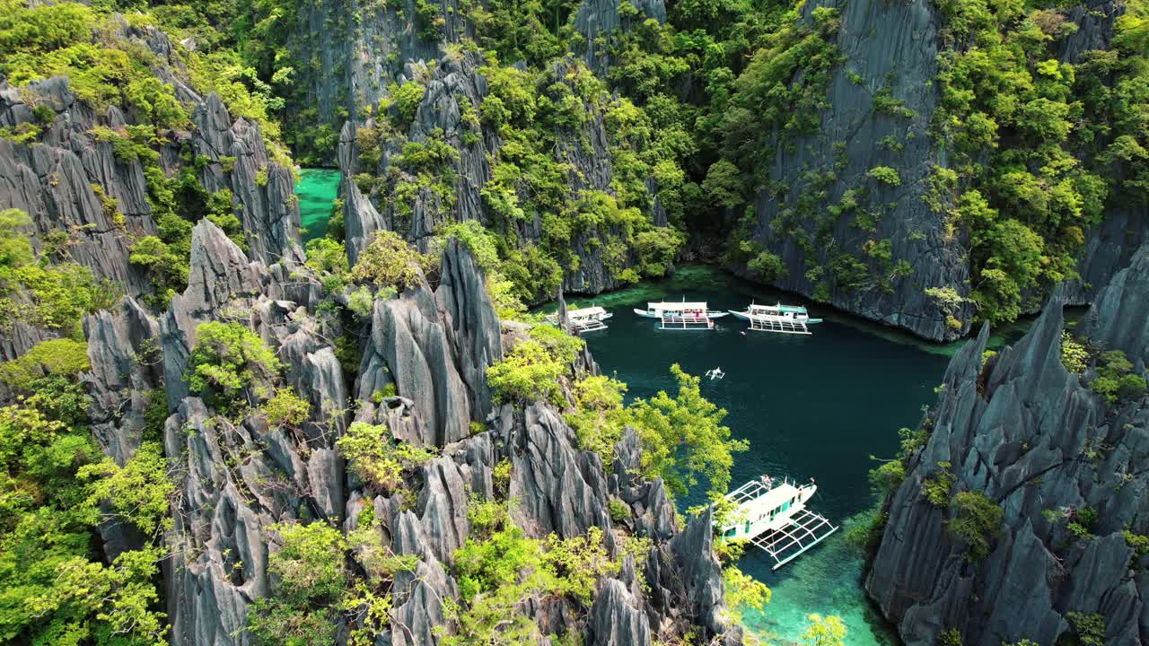 4k Drone Flys Near Karst Cliffs at Twin Lagoon, Coron, Palawan Philippines