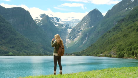 woman hiking in a norwegian fjord landscape