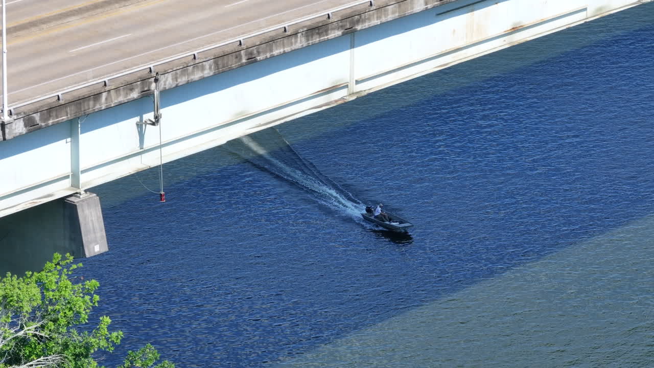 Drone shot of a speedboat and rowing team on the Tennessee River in Chattanooga, Tennessee