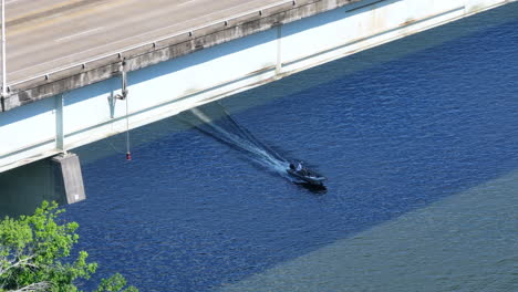 drone shot of a speedboat and rowing team on the tennessee river in chattanooga, tennessee