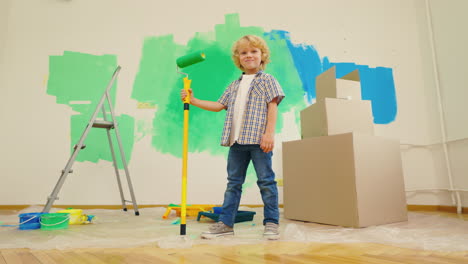 child painting a room during a move
