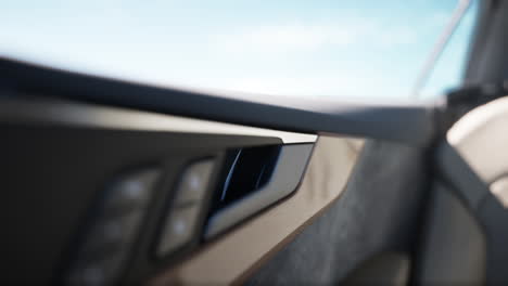 close up of a car door handle in a luxury car