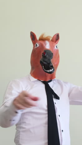 man wearing a horse mask