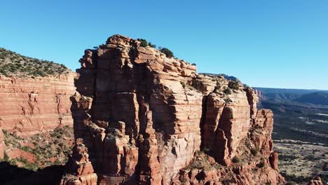 majestic orange sandstone mountain in arizona, aerial drone shot
