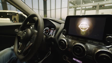 interior view of a nissan car in a showroom