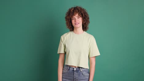 adult woman on studio giving a thumbs up gesture