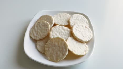 round cookies in white chocolate on a white table. sweet morning.