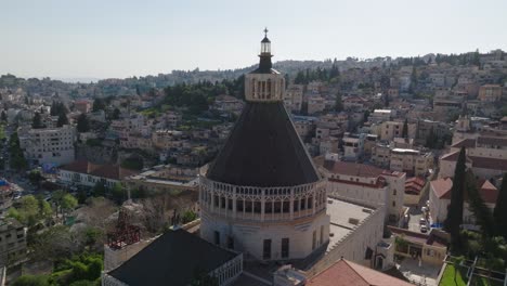 aerial orbits multi-sided dome atop church of the annunciation, israel