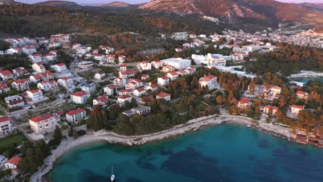 View-of-the-Hvar-Town,-Hvar-Island,-Dalmatia,-Croatia---Famous-landmark-and-touristic-destination-for-travel-in-Europe---aerial-drone-shot