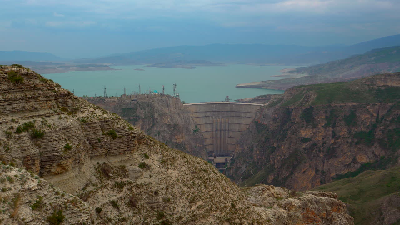 hydroelectric dam in mountain canyon water reservoir energy infrastructure power generation renewable electricity hydro engineering landscape