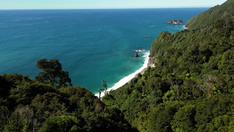 New-Zealand-west-coast-travel-holiday-destination-for-nature-lovers-aerial-view-of-sunny-day-over-the-coast