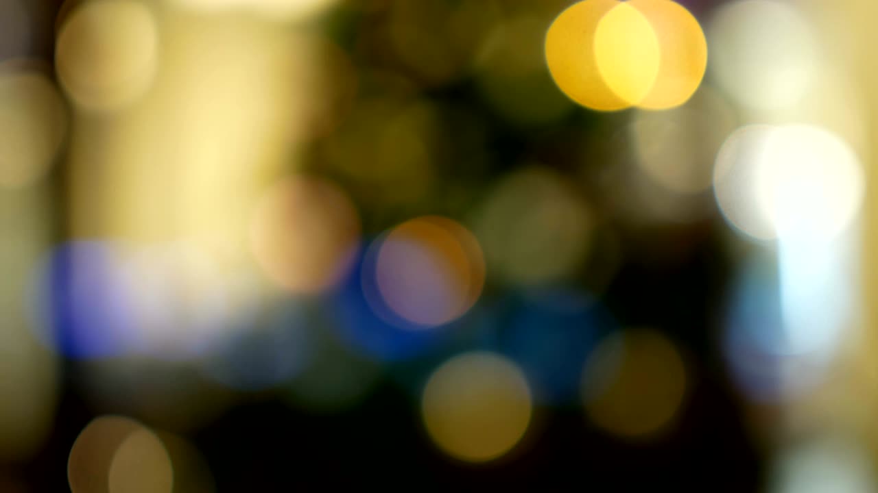 Christmas tree sparkles with colorful lights. Blurred New Year garlands. Boke blur.