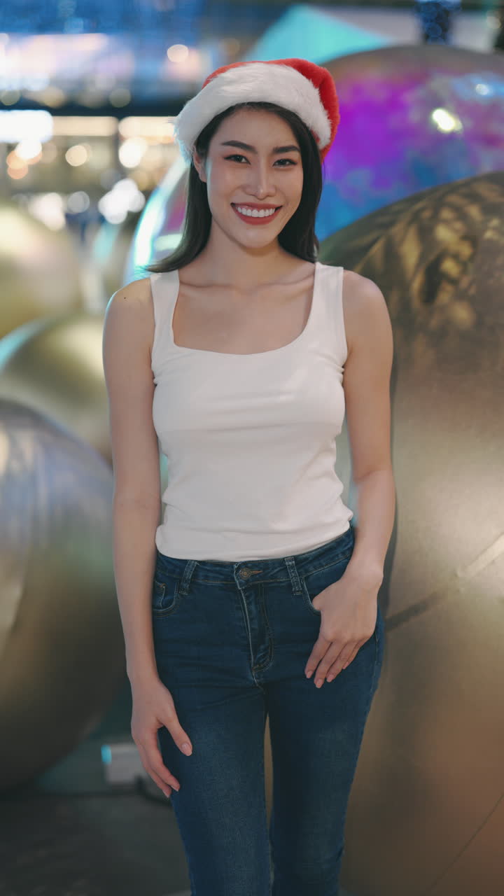 Woman Wearing Santa Hat and Smiling