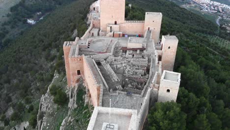 jaen's castle saint catalina castle spain shoot with a drone at 4k 24fps showing the exterior and the city from multiple points on a afternoon in december.