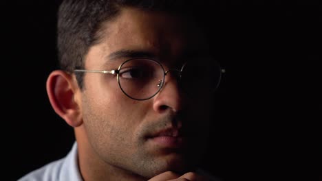 close-up image of a handsome man contemplating