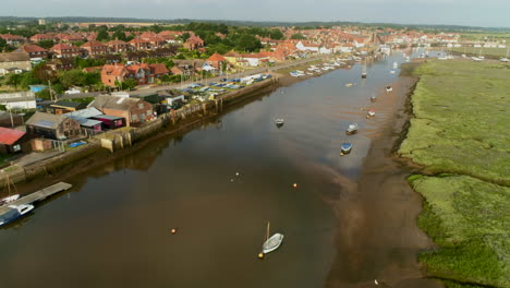 establishing drone shot along wells-next-the-sea coastal town creek north norfolk uk east coast