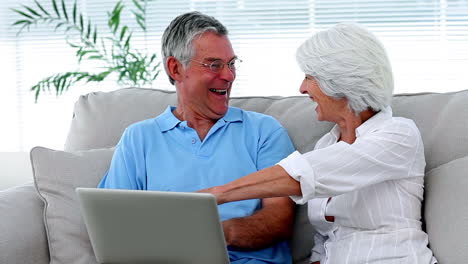 Retired-couple-using-laptop-together