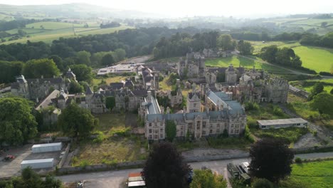 haunted denbigh lunatic asylum, north wales, aerial anti-clockwise rotate from far, sunny afternoon