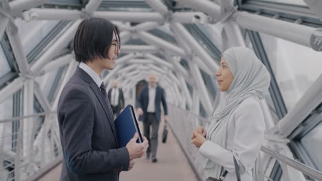 businesspeople in conversation on a modern bridge