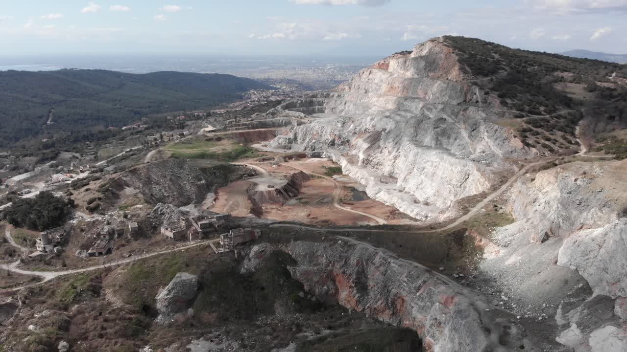 Aerial view quarry open pit sunny day big city background