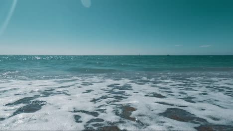 wave flushing the sand on beautiful beach