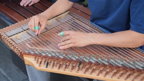 person playing an oud