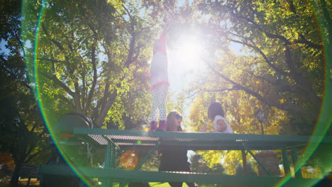 children playing in the park on a sunny autumn day