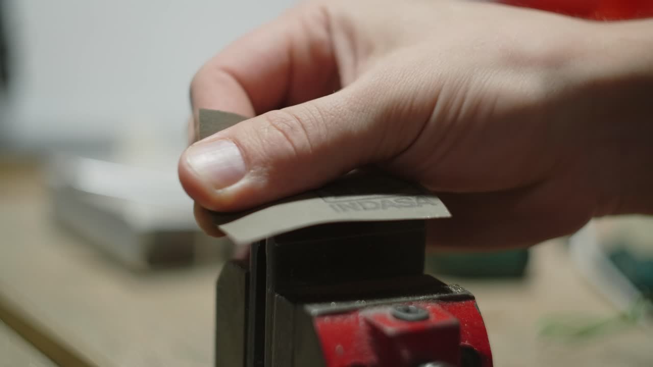 Polishing Metal Object with Sandpaper