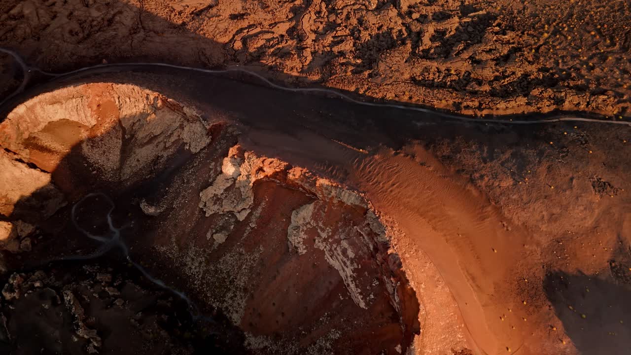 Breathtaking aerial drone footage of Volcano del Cuervo at sunset in Lanzarote, Canary Islands, Spain.