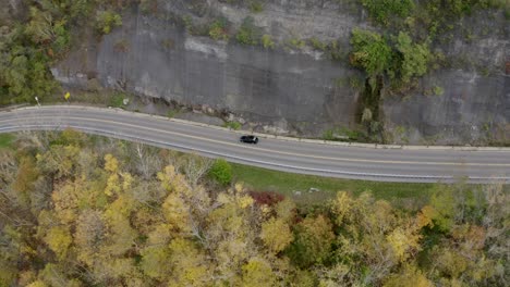 Drone-following-car-over-damn