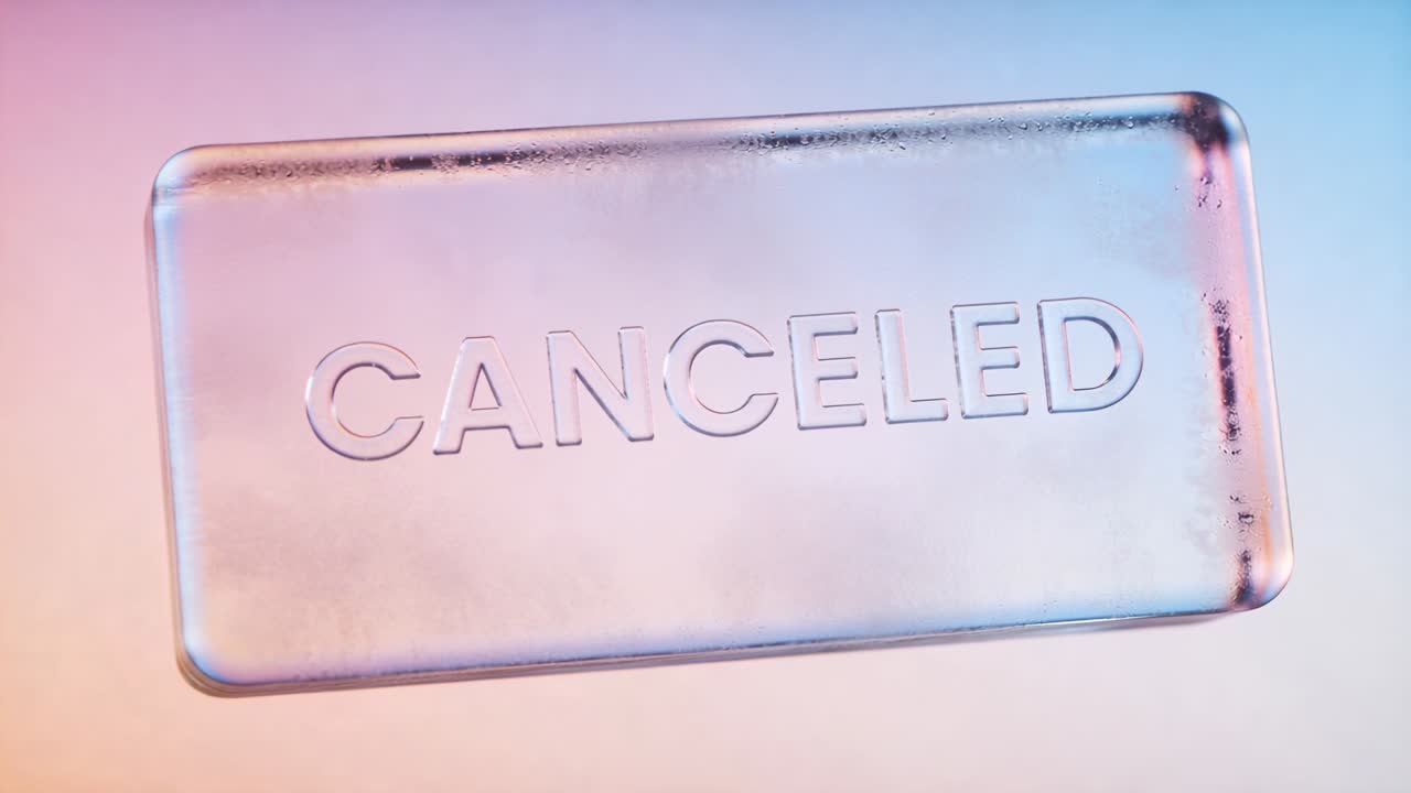 Rotating glass plaque responding to soft light, centering on pastel gradient, revealing CANCELED
