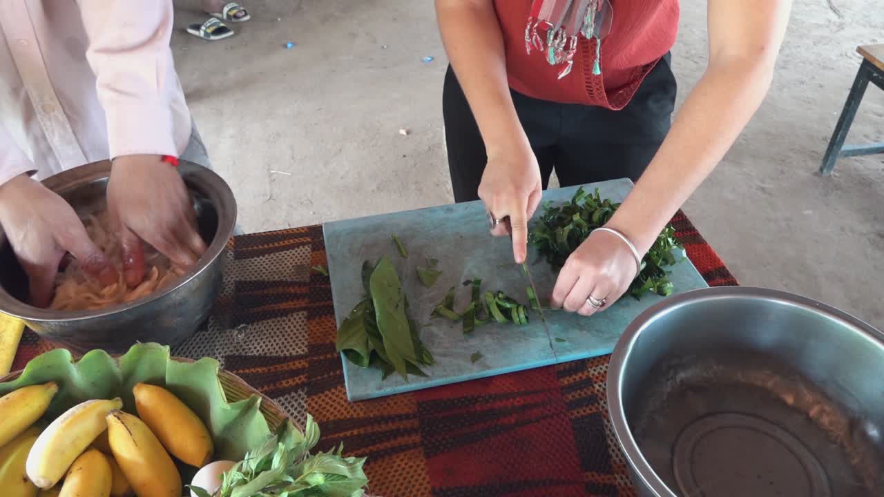 Slow Motion Shot of Leaves Being Chopped for Ingredients at a Khmer Cooking Class in Cambodia