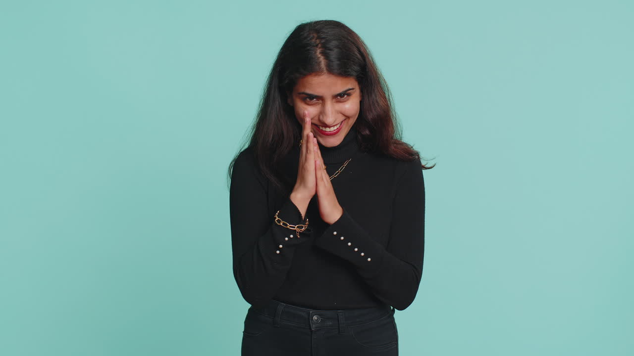 Sneaky cunning indian woman with tricky face scheming evil plan, devious villain idea, jokes, pranks