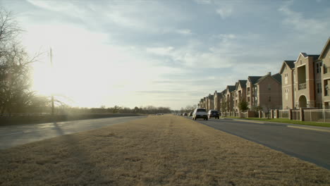 cars zoom by during the sunset