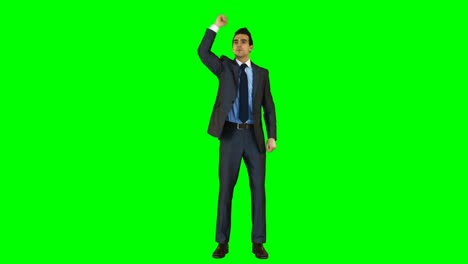 businessman gesturing against green background