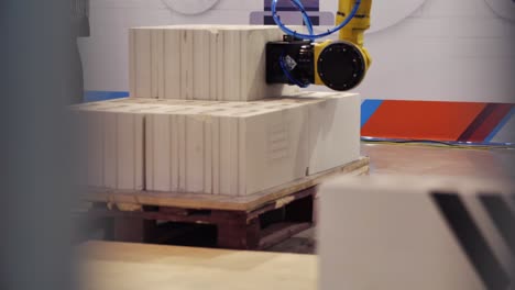 industrial robot handling ceramic bricks