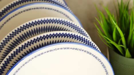 stack of blue and white decorative plates