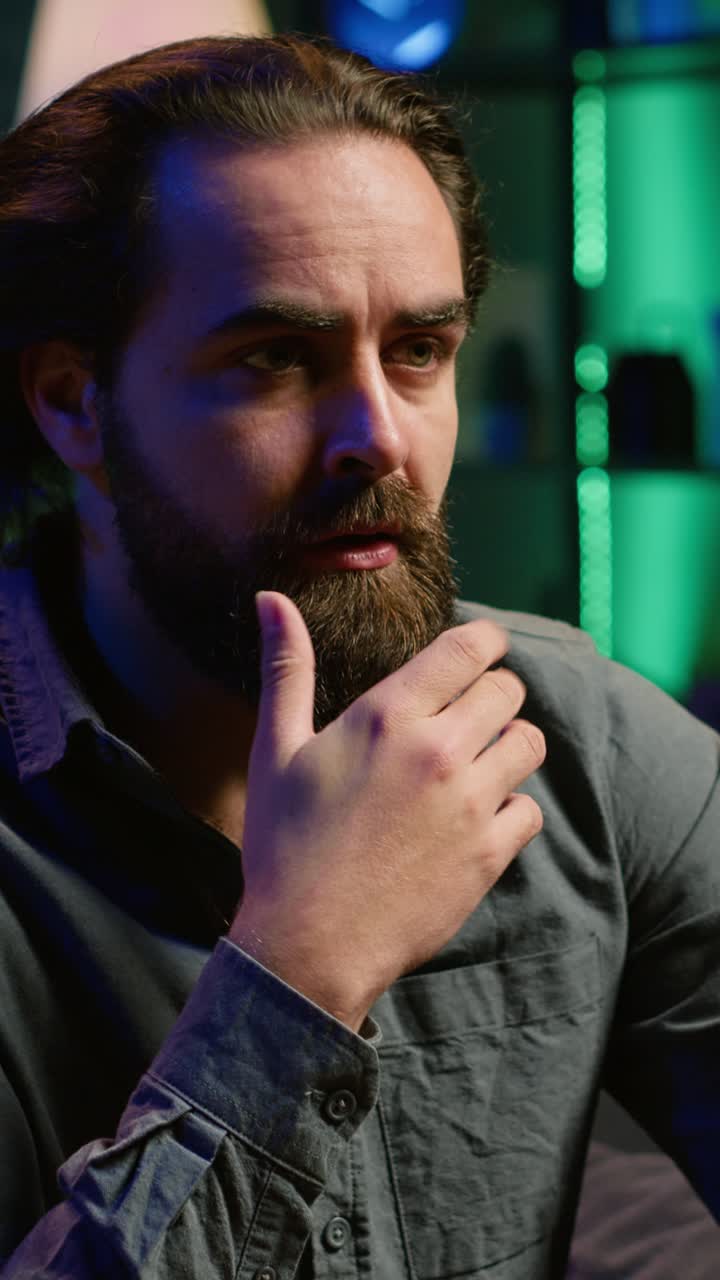 Vertical video Man watching suspenseful thriller film, eating popcorn, close up