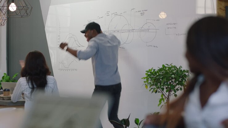 young african american business people celebrating corporate victory happy team leader businessman dancing funny in boardroom presentation meeting seminar