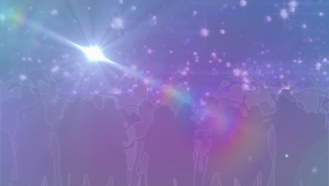 manchas brillantes de luz contra las siluetas de personas bailando