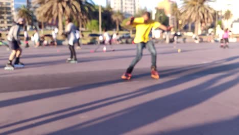 blurred shot of a guy sliding in skatepark with his rollers