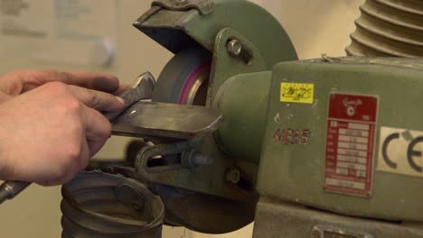 close up of the sharpening process of a stonecutter tool