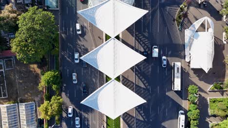 top-down view over eroii revolutiei square, heroes' gate monument, and the morning traffic, bucharest, romania